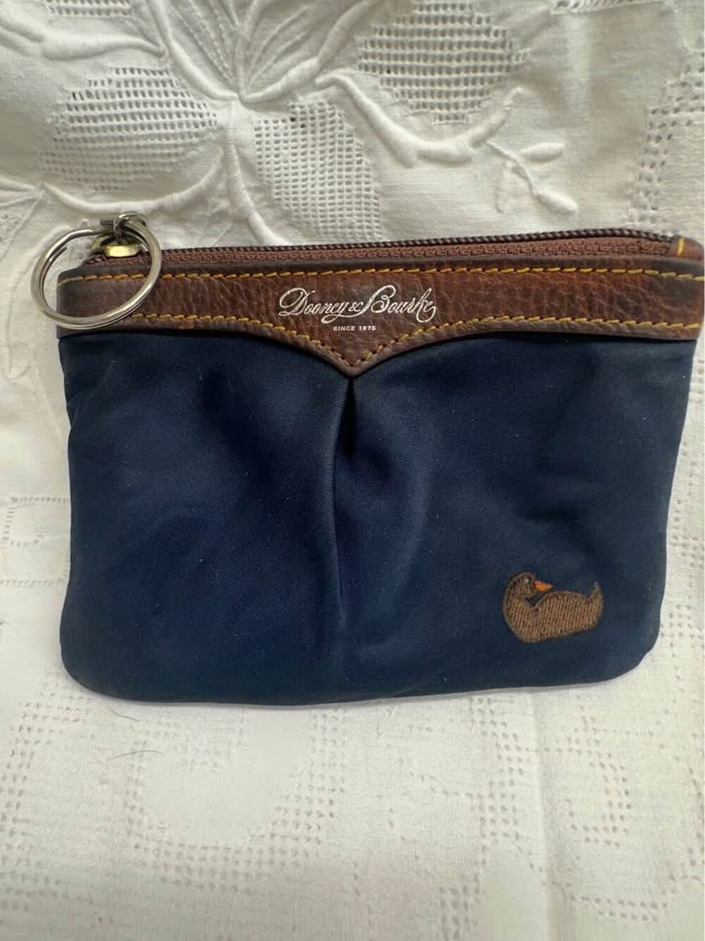 Pre-loved Dooney & Bourke Navy Duck Logo Key Ring. Fair cond Rehab pouch. B-329
